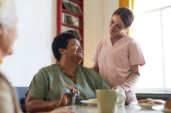 Senior woman talking with carer